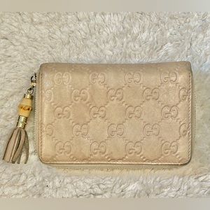 AUTHENTIC Gucci leather embossed monogram zip around long wallet - beige